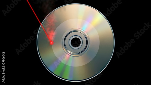 Rotating CD DVD burning animation with laser beam photo