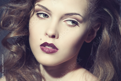 Closeup portrait of a sexy young woman with red lips