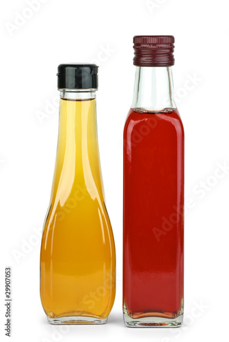 Two bottles with apple and red wine vinegar