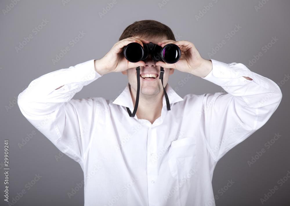 Young businessmen in t-shirt with black binocular Young businessmen in t-shirt with black binocular