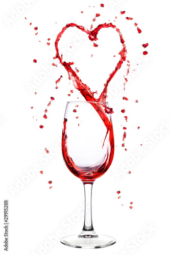 Wine splashing from wineglass in heart shape