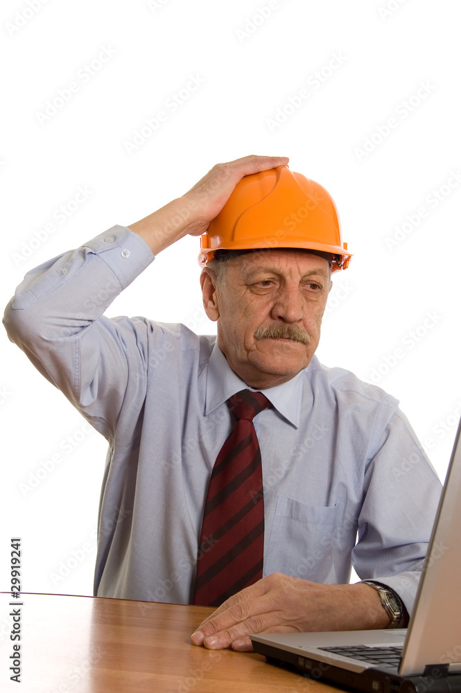 Engineer at the computer isolated on white background