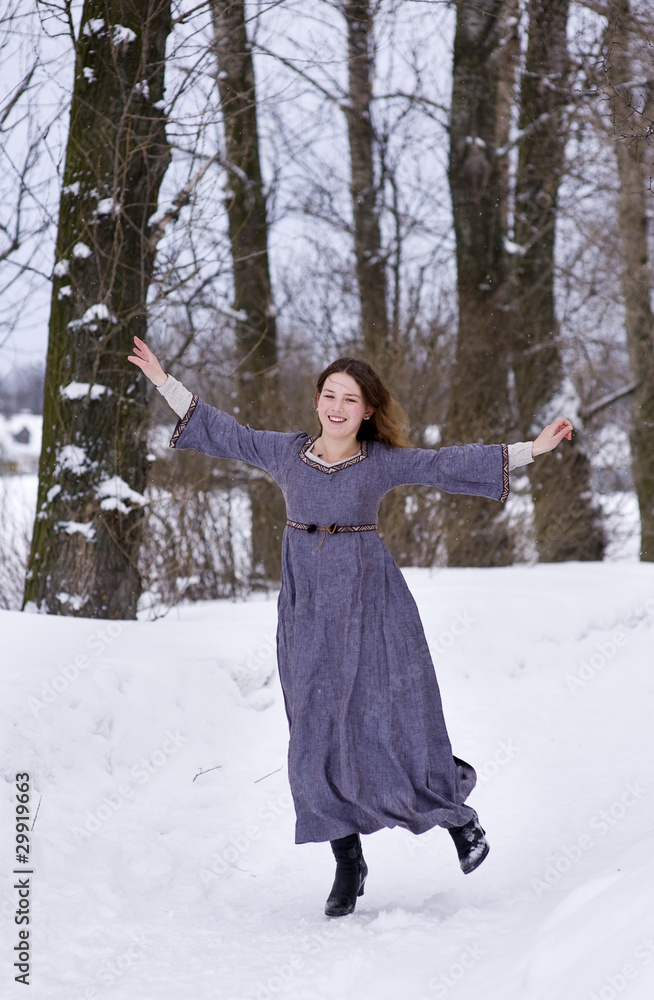 Dancing young girl in medieval dress Dancing young girl in medieval dress