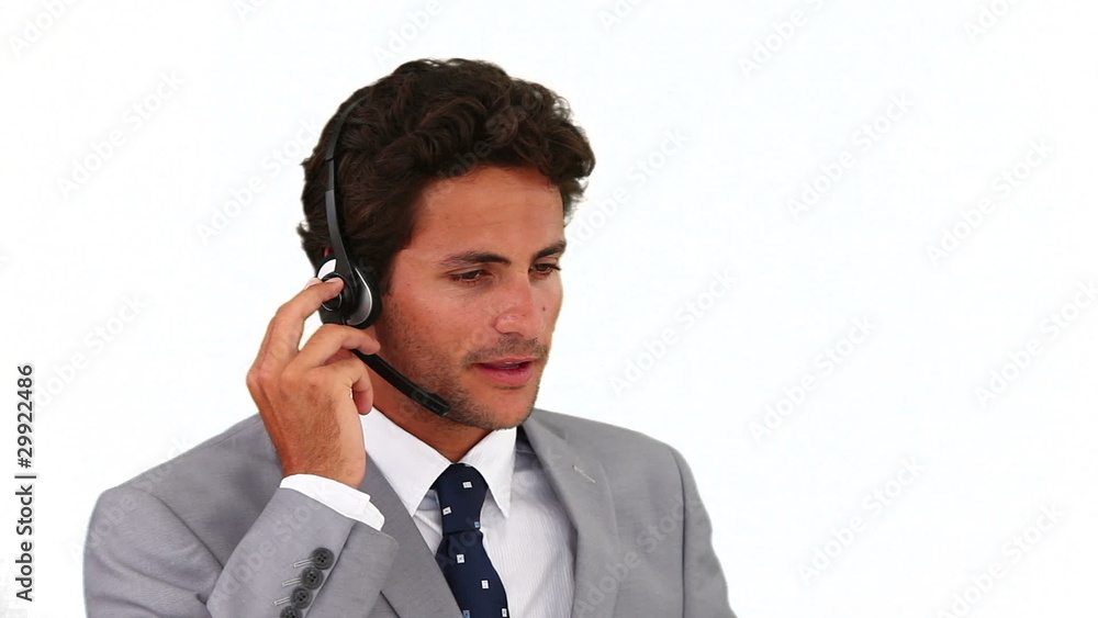 Dark-haired businessman talking on the phone Dark-haired businessman talking on the phone