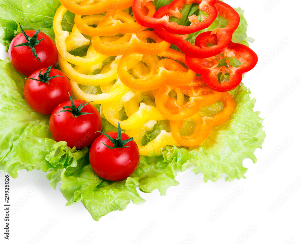 Mix of fresh vegetables from a colored paprika on leaves Mix of fresh vegetables from a colored paprika on leaves