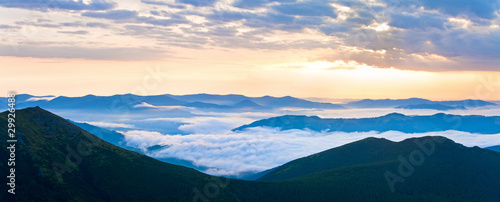 Summer cloudy sunrise mountain panorama