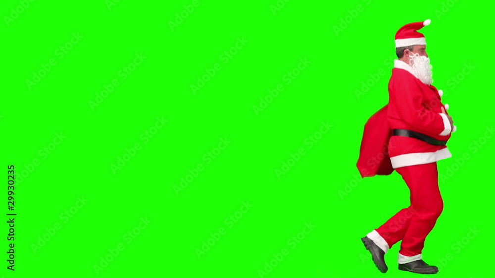 Santa Claus with his gifts bag dancing Santa Claus with his gifts bag dancing