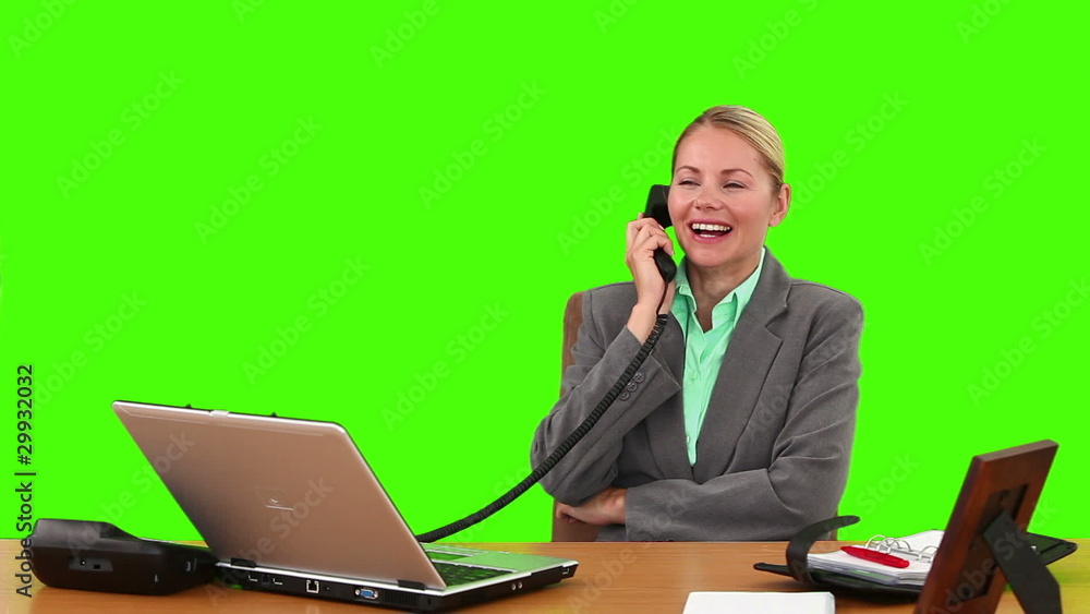 Pretty businesswoman having a phone call at her desk Pretty businesswoman having a phone call at her desk