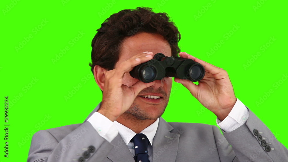 Businessman looking through binoculars Businessman looking through binoculars