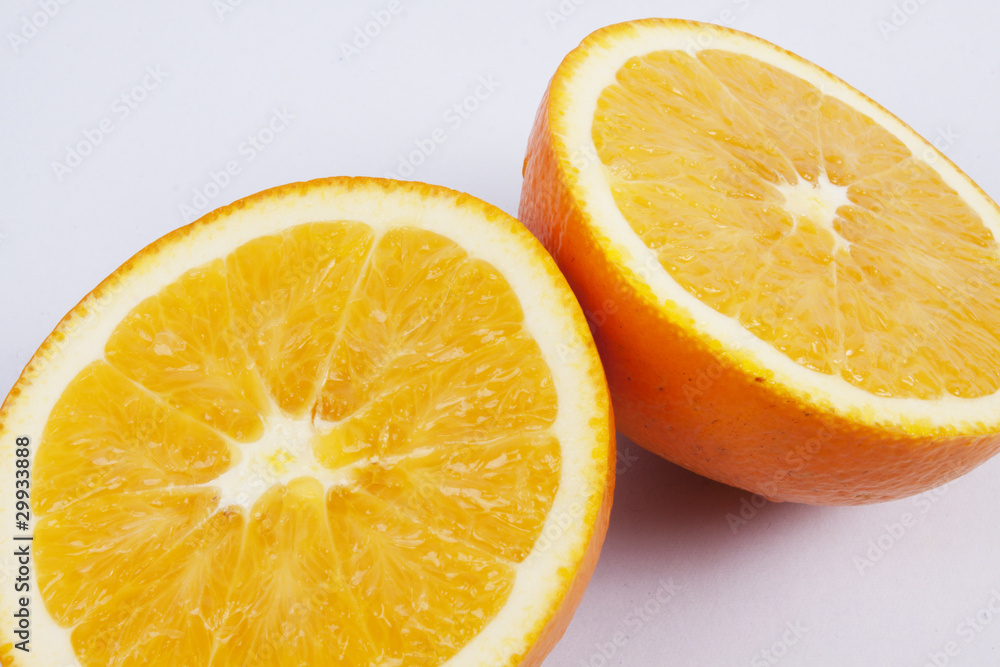 Two pieces of orange, Two pieces of orange, showing texture. Two pieces of orange, Two pieces of orange, showing texture.