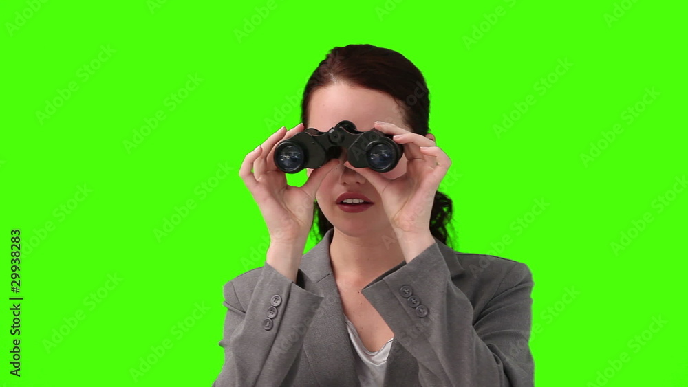 Woman looking through binoculars Woman looking through binoculars