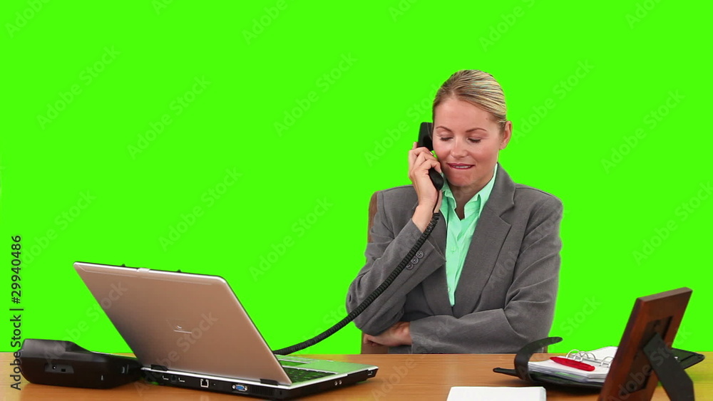 Blond businesswoman in suit having a phone call Blond businesswoman in suit having a phone call