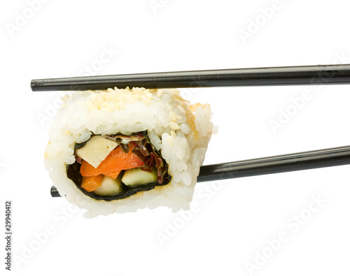 Sushi with chopsticks isolated over white background