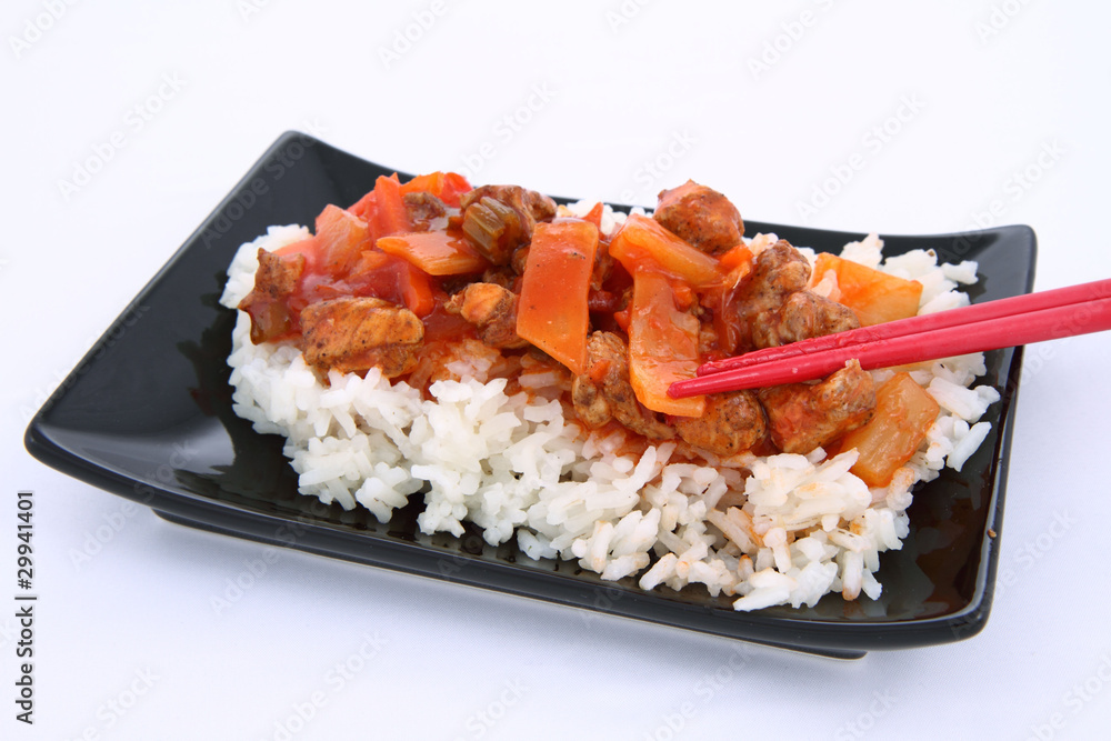 Chinese food-sweet and sour chicken-being eaten with chopsticks Chinese food-sweet and sour chicken-being eaten with chopsticks