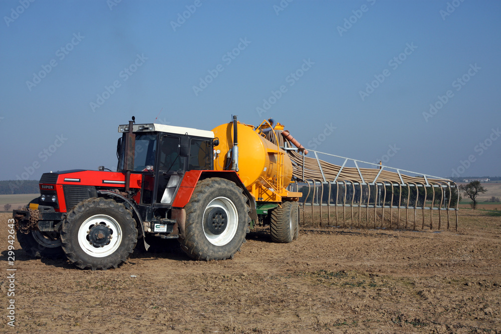 red tractor with yellow sprayer tank