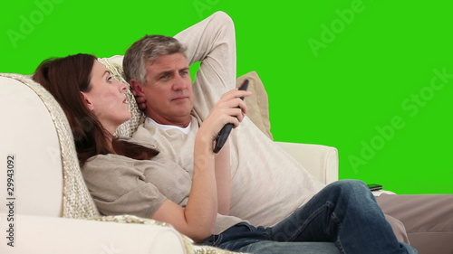 Mature couple talking on the sofa photo