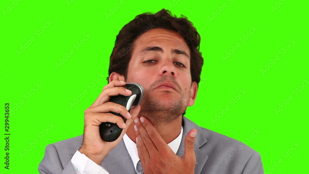 Young businessman shaving Young businessman shaving