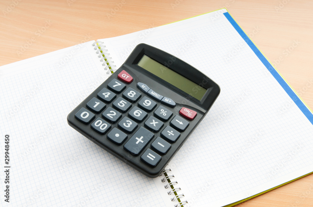 Business concept with notepad and calculator Business concept with notepad and calculator