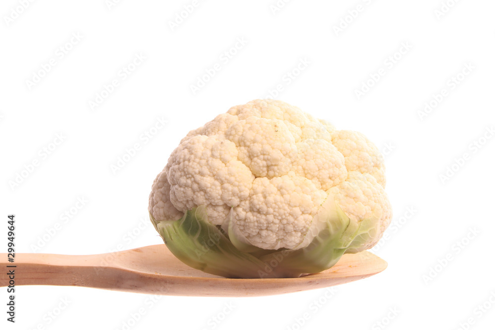 Mini cauliflower on a wooden spoon