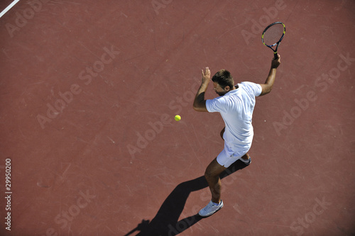 young man play tennis