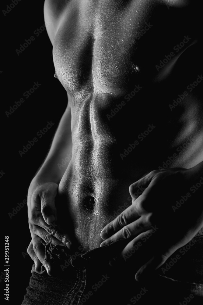 Sexy muscular naked man with water drops on stomach Stock-Foto | Adobe Stock