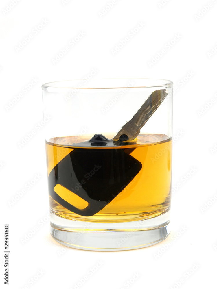 A car key in a glass of whisky A car key in a glass of whisky