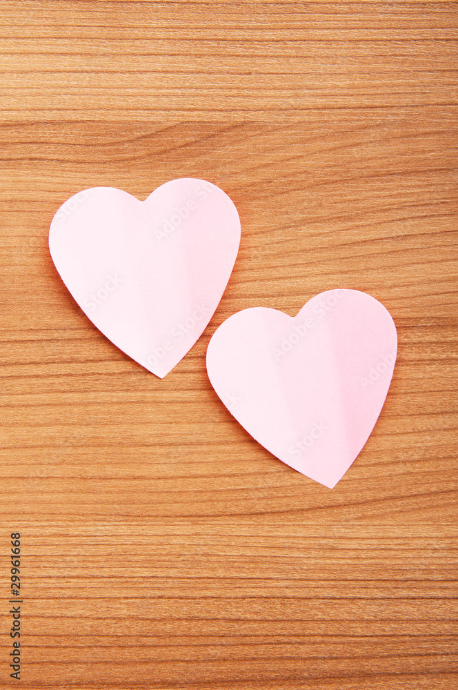 Heart shaped sticky notes on the background Heart shaped sticky notes on the background