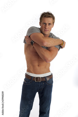 Male taking shirt off isolated