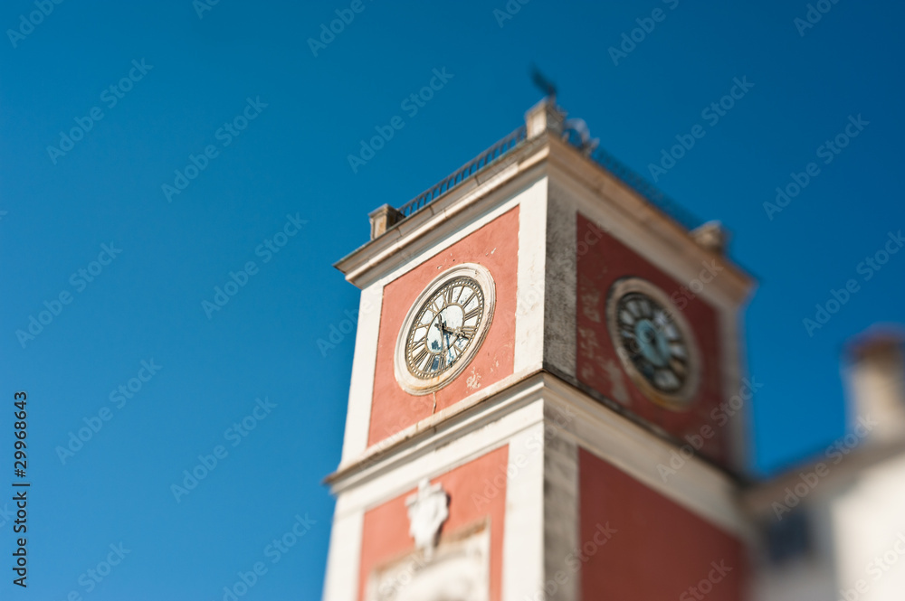 Ancient clock tower at square of Rovinj, Croatia. Focus on clock