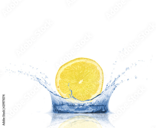 SLice of lemon falling into water