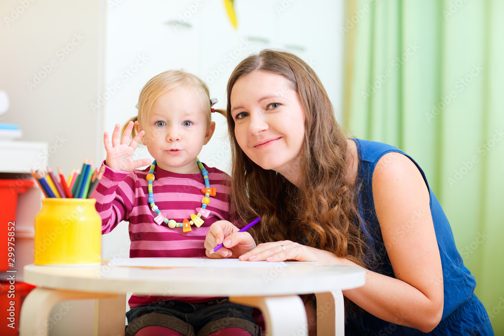Fototapeta premium Mother and daughter drawing together
