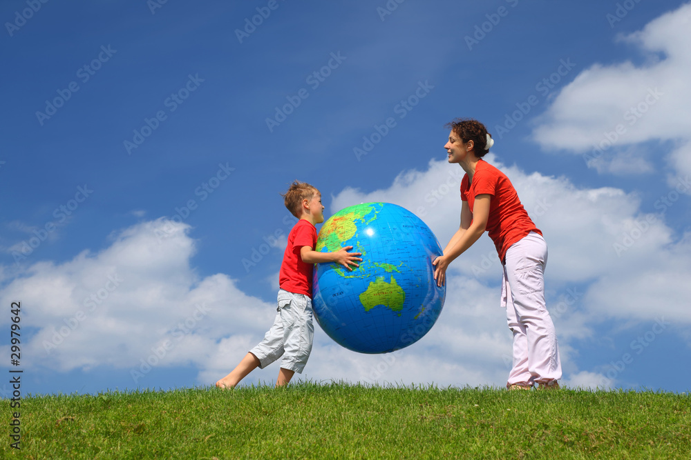 © Pavel Losevsky - Mother with son play an inflatable globe in day-time stand © Pavel Losevsky - Mother with son play an inflatable globe in day-time stand