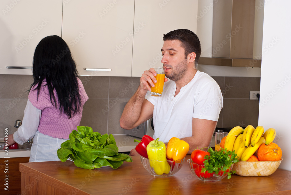 Mid adult couple in kitchen Mid adult couple in kitchen