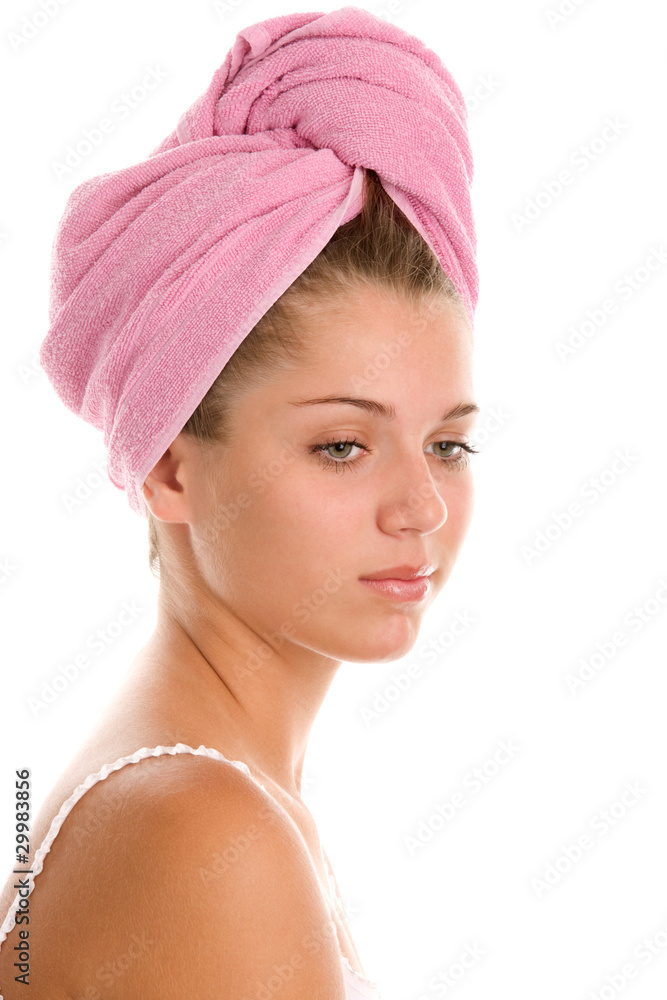 Pensive woman with towel wrapped around head Pensive woman with towel wrapped around head