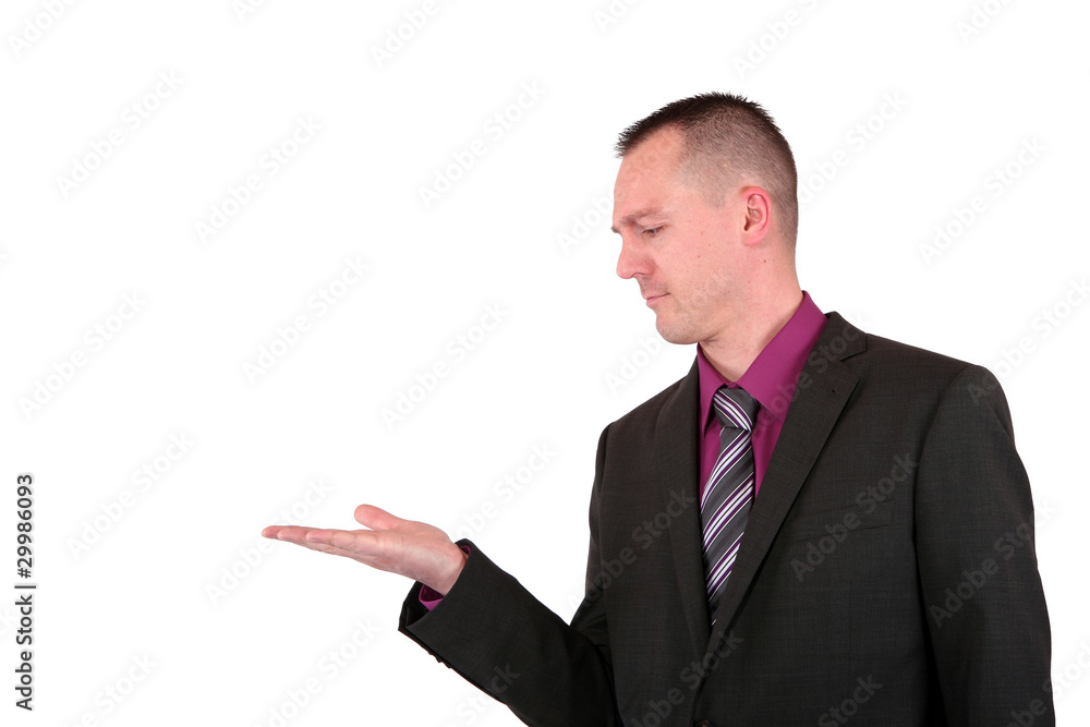 Handsome young businessman presenting something Handsome young businessman presenting something