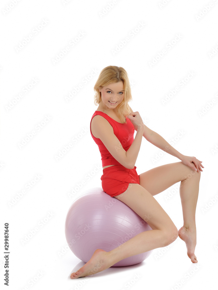 Pretty sporty fitness woman doing exercise with pilates ball. is Pretty sporty fitness woman doing exercise with pilates ball. is