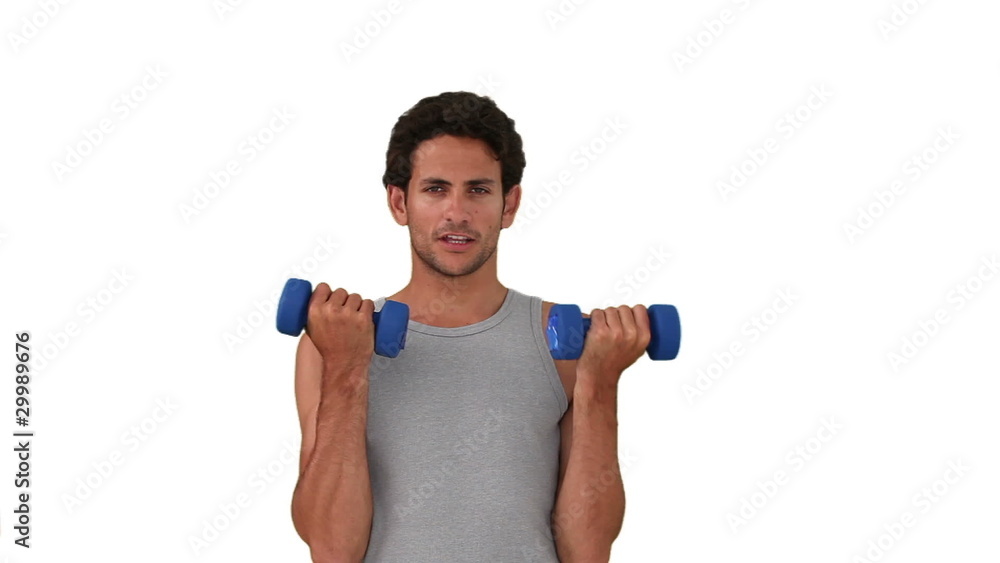 Dark-haired man in sportwear doing exercise Dark-haired man in sportwear doing exercise