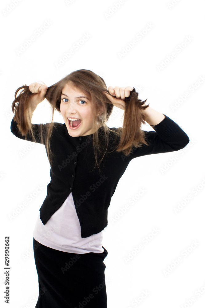 Emotional girl pulling her hair over white background Emotional girl pulling her hair over white background