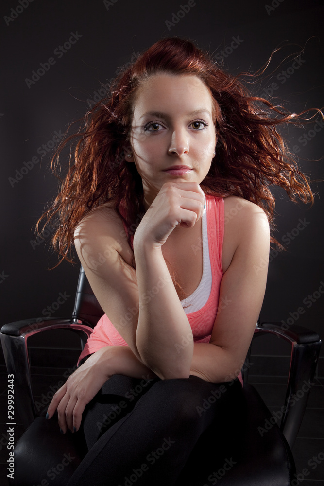 Naklejka premium Young woman studio portrait