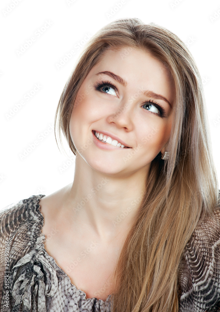 Portrait of a smiling thinking woman looking up Portrait of a smiling thinking woman looking up