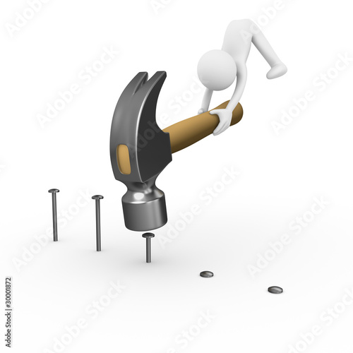 Man crushing nails with a big construction hammer
