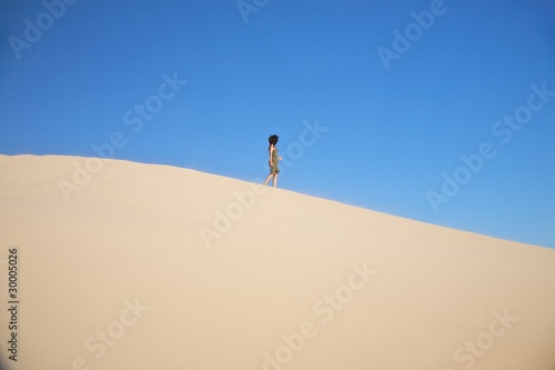 woman walking on great sand dune