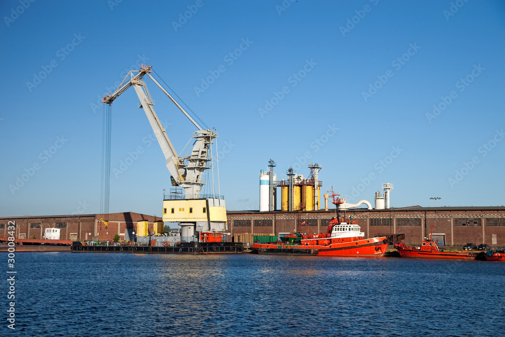 Floating crane standing on the waterfront of the port. Floating crane standing on the waterfront of the port.