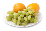 bunch of grapes and orange on a plate