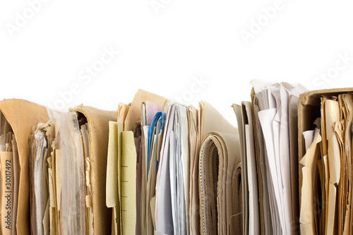 Stack of old paper files isolated on white. Horizontal view