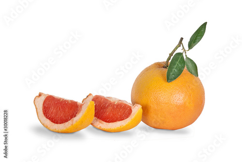 Close up of grapefruit and segments isolated on white background