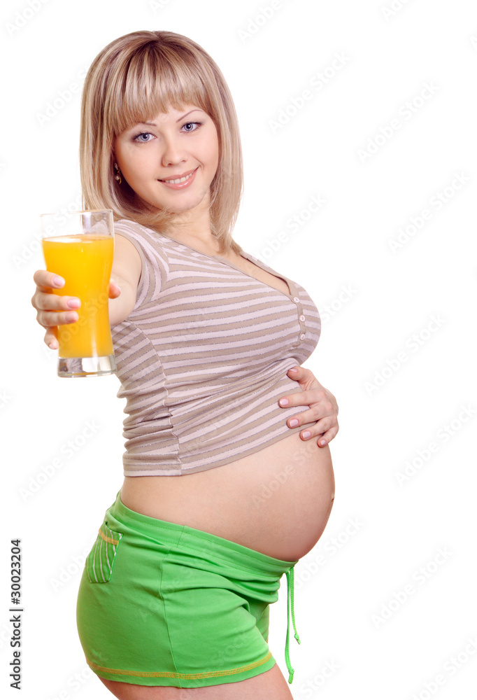 Portrait of pregnant woman with orange juice in hand isolated on Portrait of pregnant woman with orange juice in hand isolated on