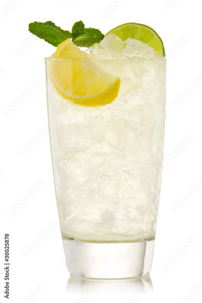 Cocktail with lime and lemon isolation on a white Cocktail with lime and lemon isolation on a white