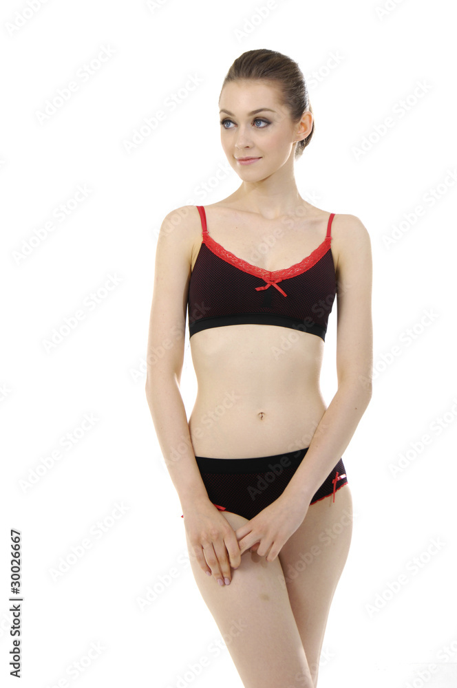 Fashion model posing in black lingerie on white lingerie Fashion model posing in black lingerie on white lingerie