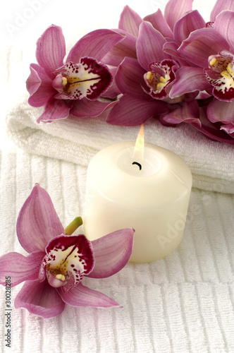 Spa composition (white towel and pink orchids on towel)
